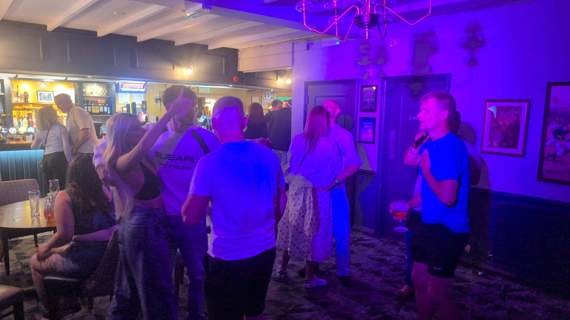 Guest singing karaoke at a Sussex pub party