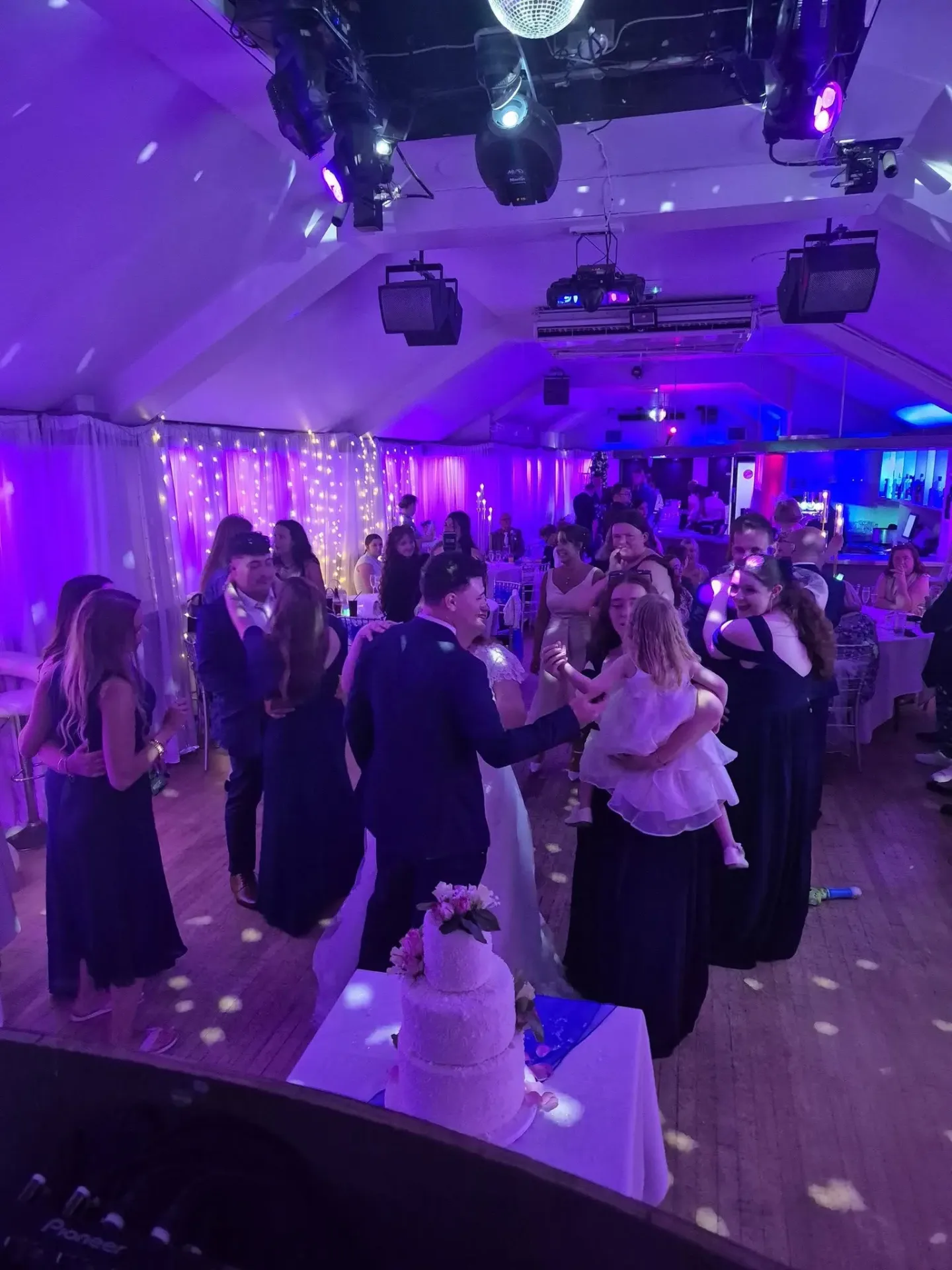 Bride and groom dancing with guests at a Sussex wedding